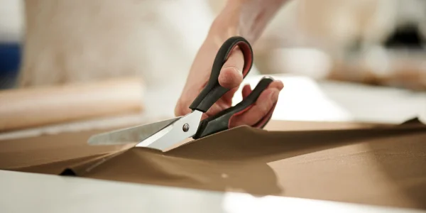 cutting a fabric to check the GSM